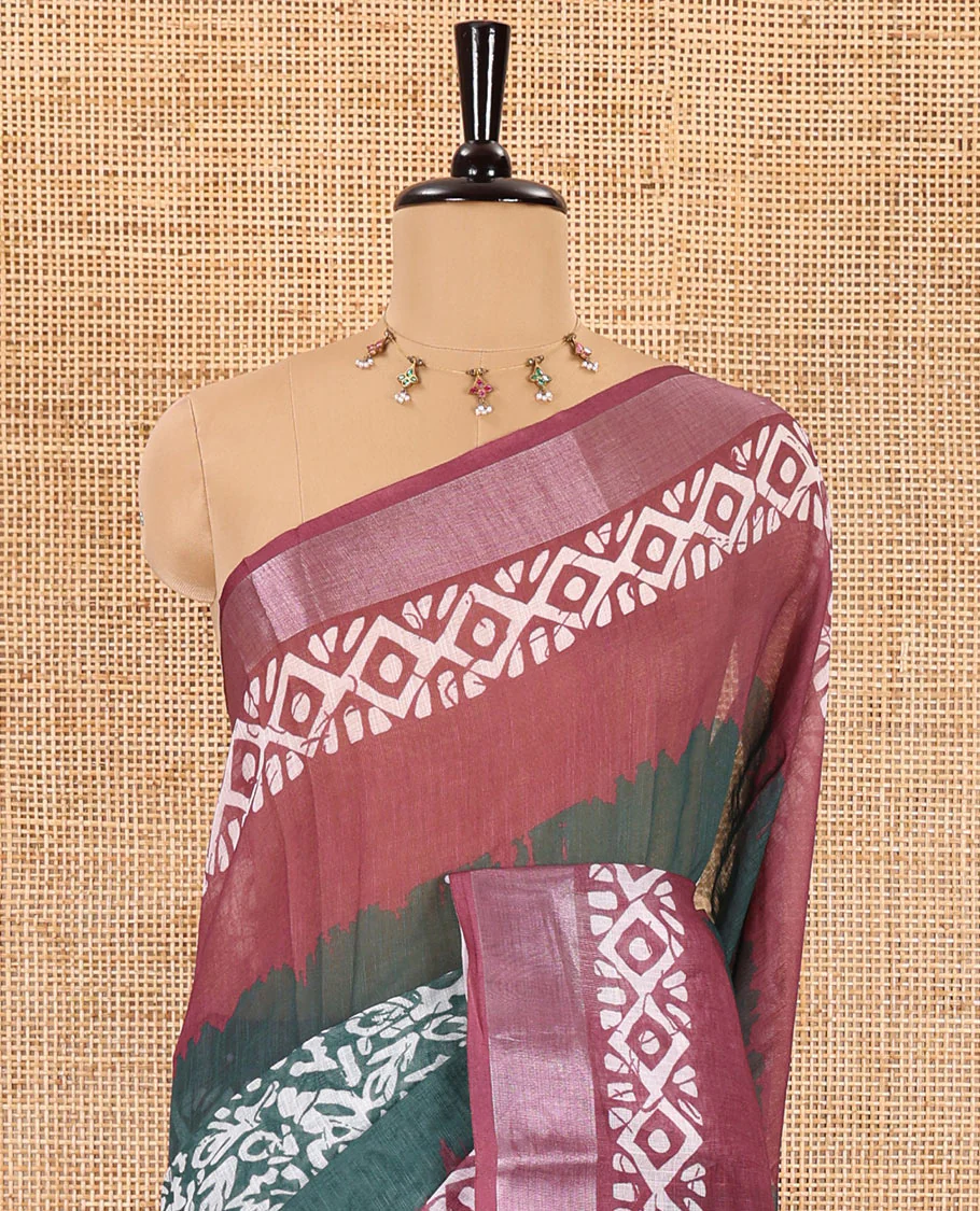 Green batik printed linen cotton saree, contrast printed and zari work border, batik printed pallu, and a contrast printed blouse - Image 3