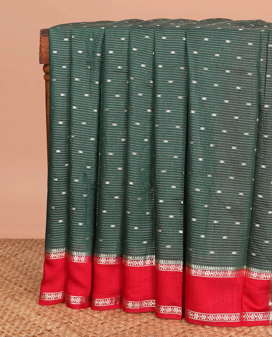 Green buttas and striped assam silk saree, contrast traditional zari border, and pallu of zari stripes