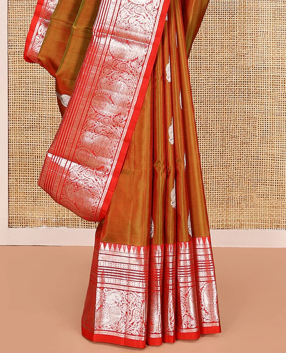 Green buttas Venkatagiri silk saree, contrast temple traditional border of peacocks, and intricate pallu - Image 4