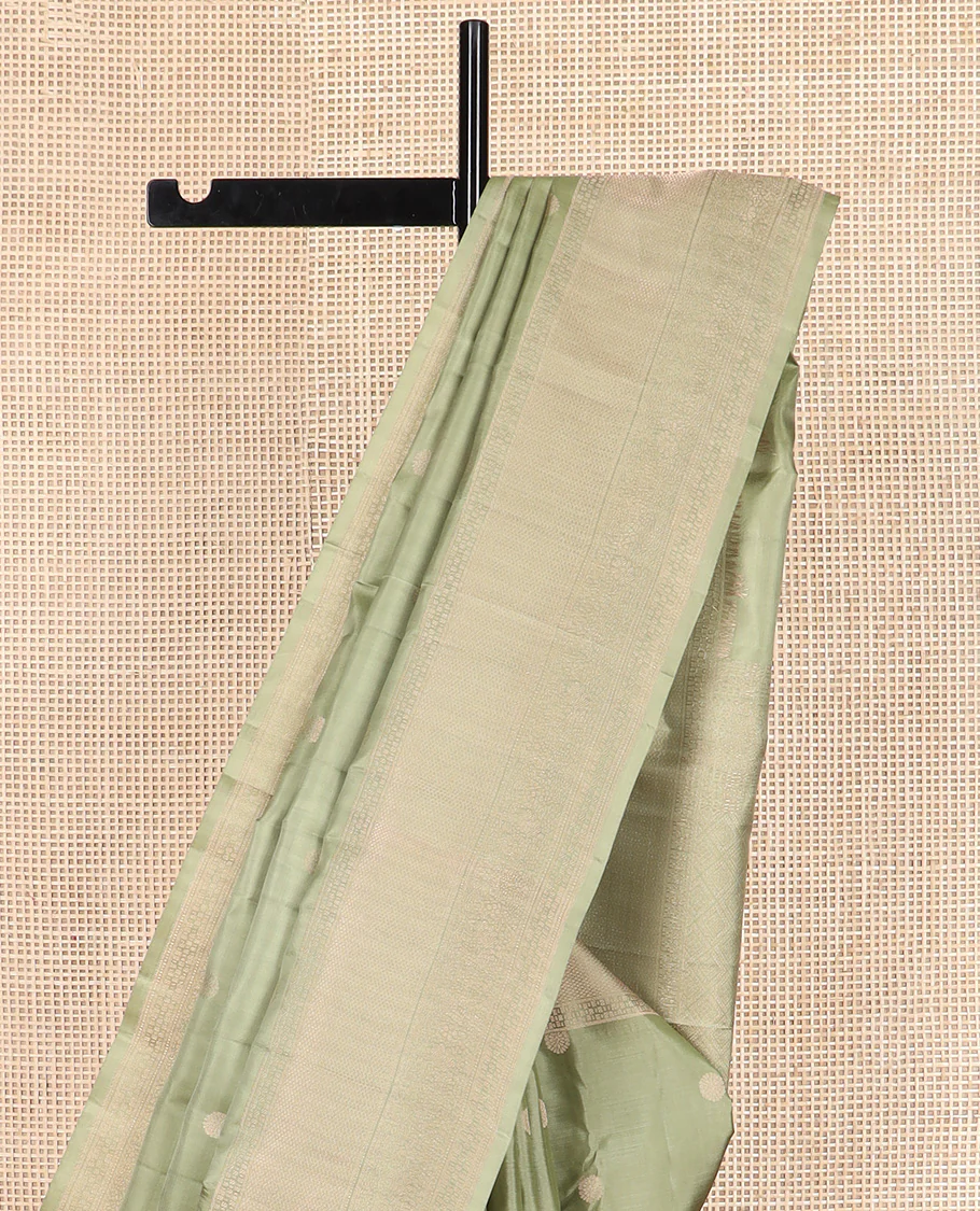Green chakram buttas Vasundhara silk saree, zari border of mayil kann and floral designs, and jaal patterned pallu - Image 3