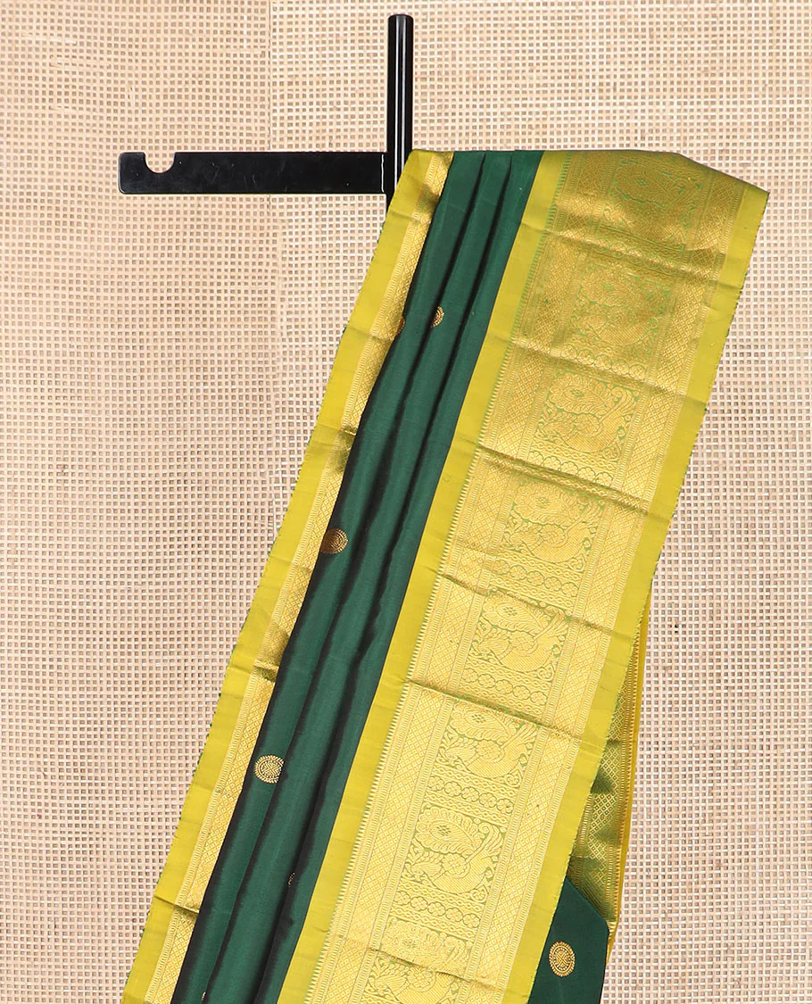 Green chakram zari buttas Kanchipuram silk saree, contrast border of rekku, muthu, mayil kann, and mayil designs, and mayil chakram motifs featured pallu - Image 3