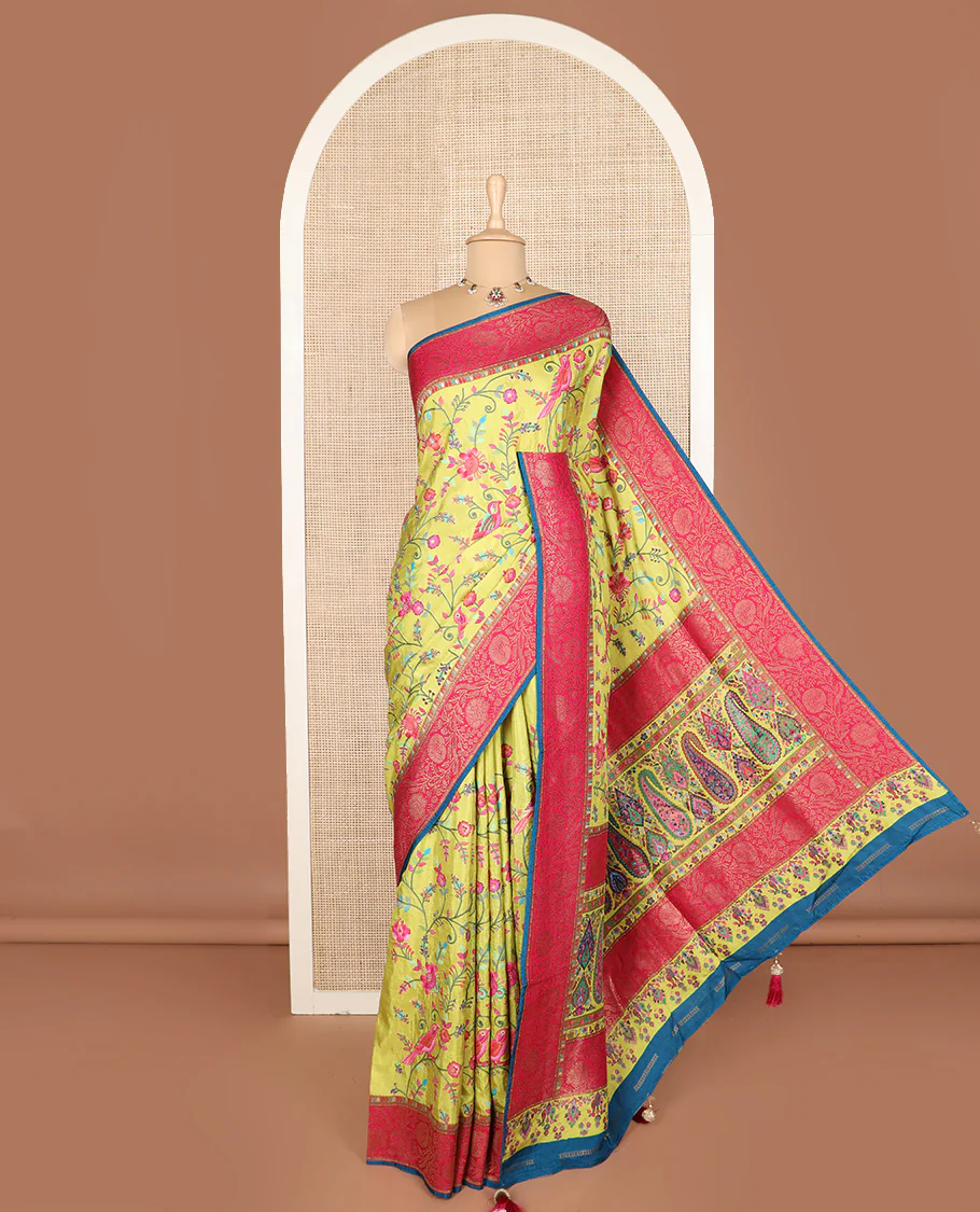 Green colorful floral vine and bird digital printed dola silk saree, contrast floral zari border, and meenakari paisleys pallu