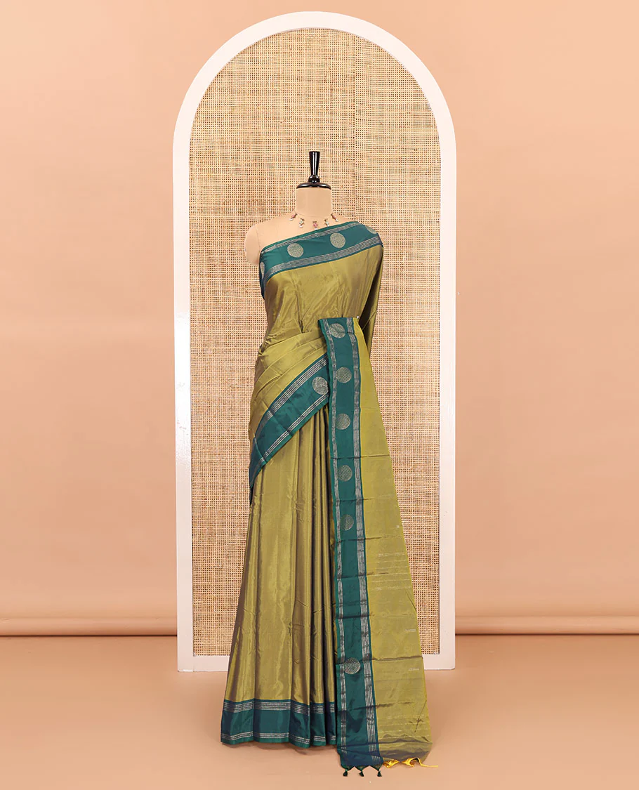 Green dobby style buttas semi-soft silk saree, contrast round buttas and striped border, striped pallu, and a plain blouse - Image 2