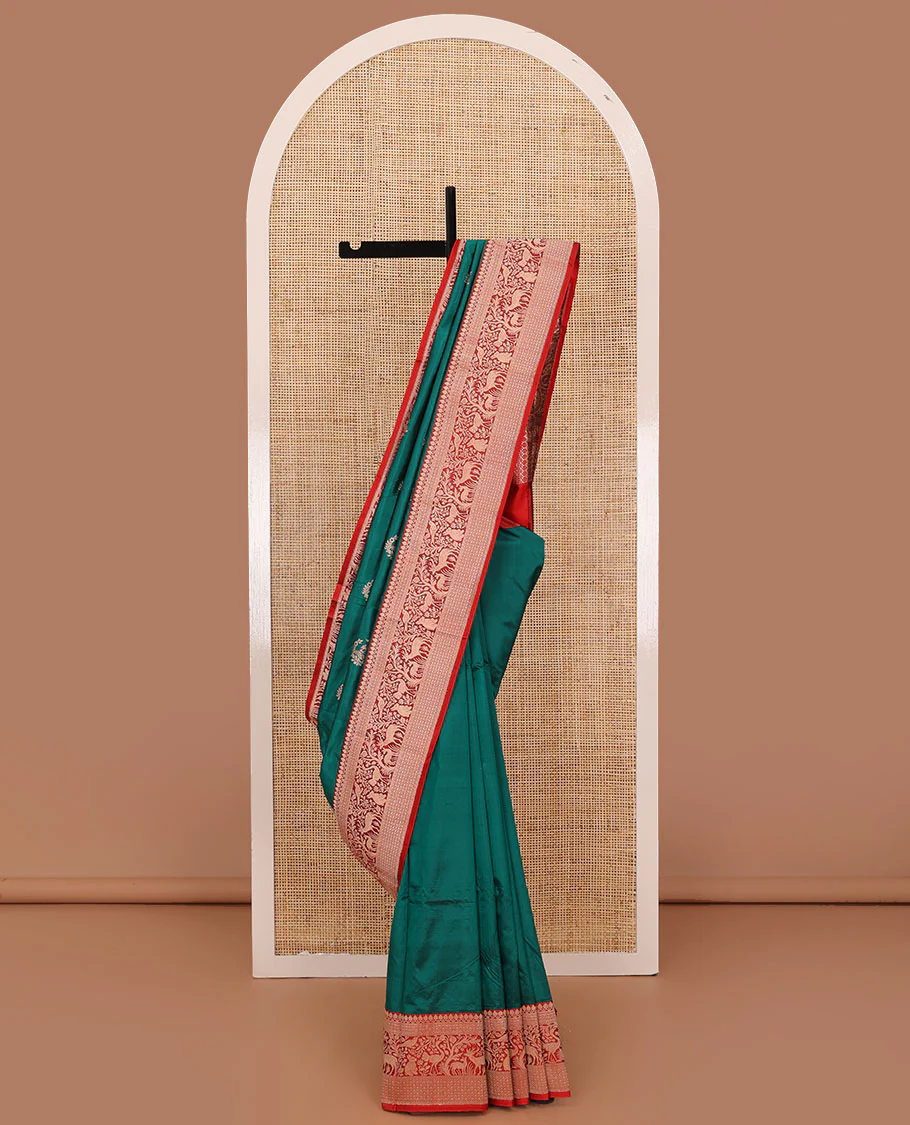 Green floral buttas katan silk saree, contrast traditional border of flora-fauna designs, and pallu of peacock, and derr motifs enclosed circles