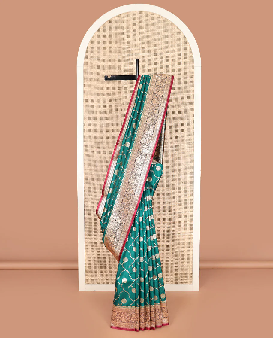 Green floral jaal jacquard banarasi silk saree, contrast floral creeper design border, and intricate ogee patterned pallu