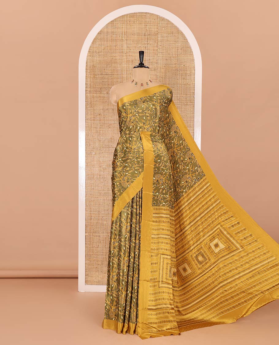 Green floral style printed Turkey crepe saree, contrast plain border, geometric printed pallu, and a contrast polka dotted blouse