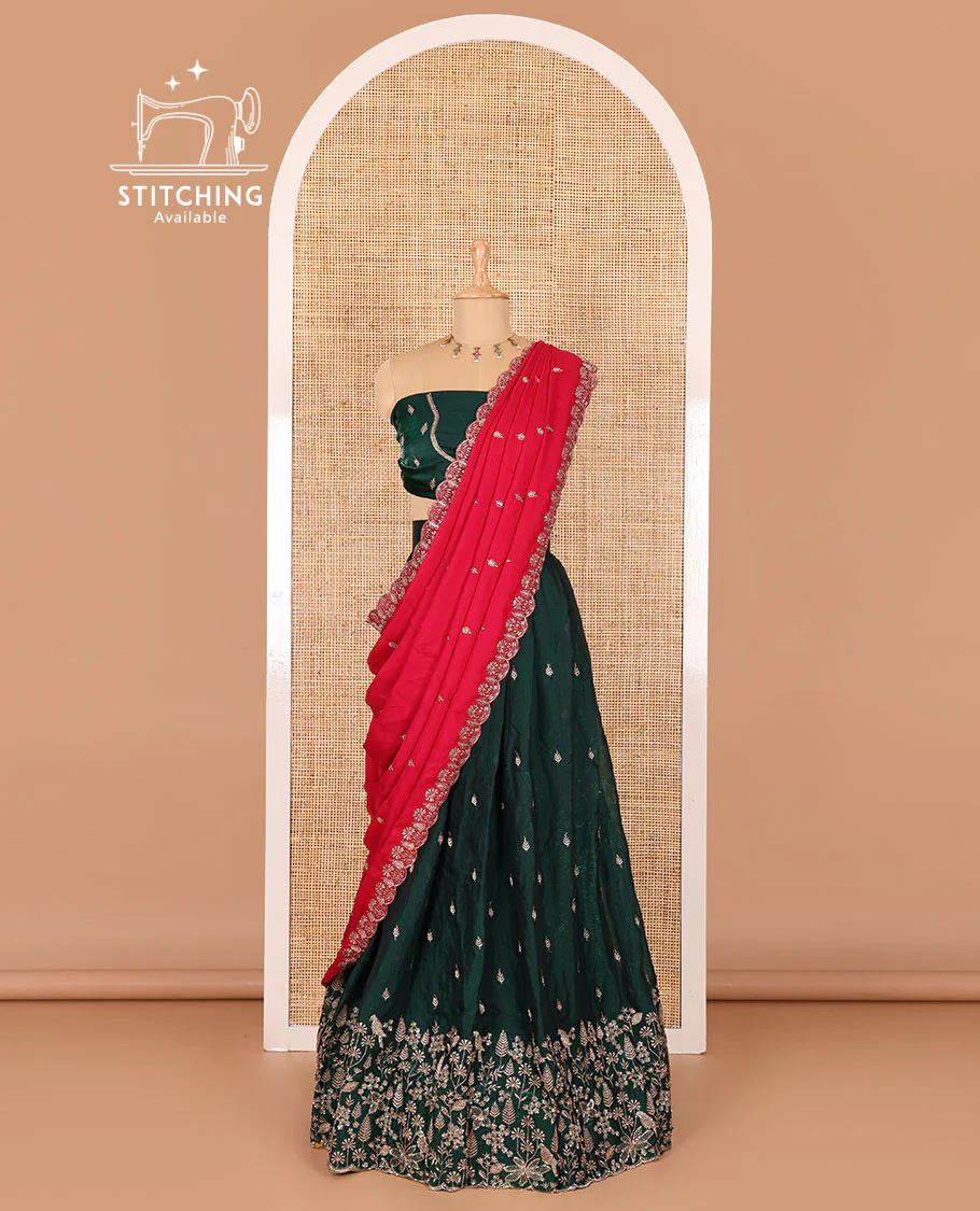 Green half-saree, floral and bird motifs embroidered velvet organza top, matching embroidered blouse, and contrast scallop embroidered syska georgette dhavani