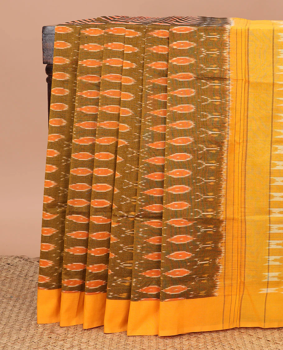 Green Ikkat Cotton Saree Bedecked with Ikkat Ogee Patterns, Complemented by a Contrast Border, and Pallu of Geometric Ikkat Patterns