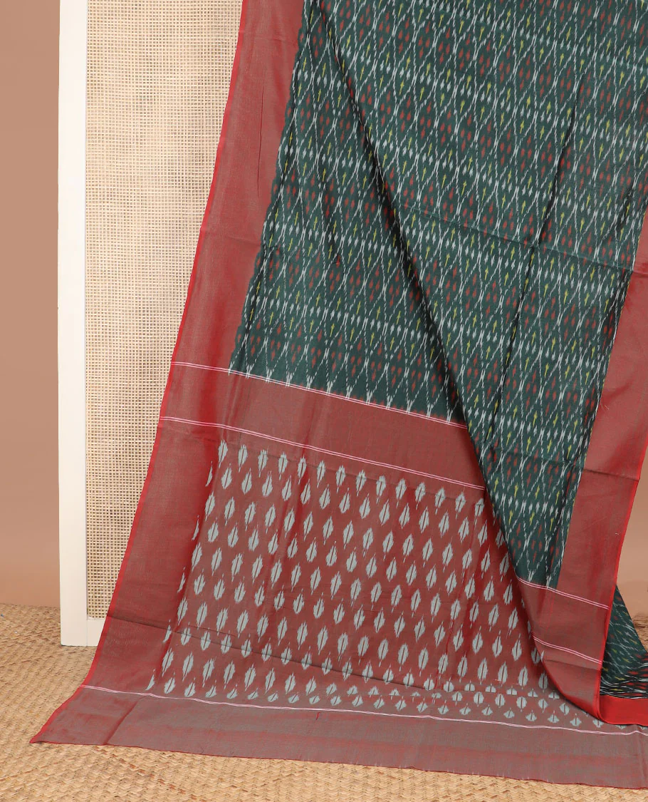 Green Ikkat Cotton Saree Decked Up with Geometric Patterns in Ikkat Weave, Complemented by a Contrast Plain Border, and Pallu Adorned with Ikkat Buttas - Image 2