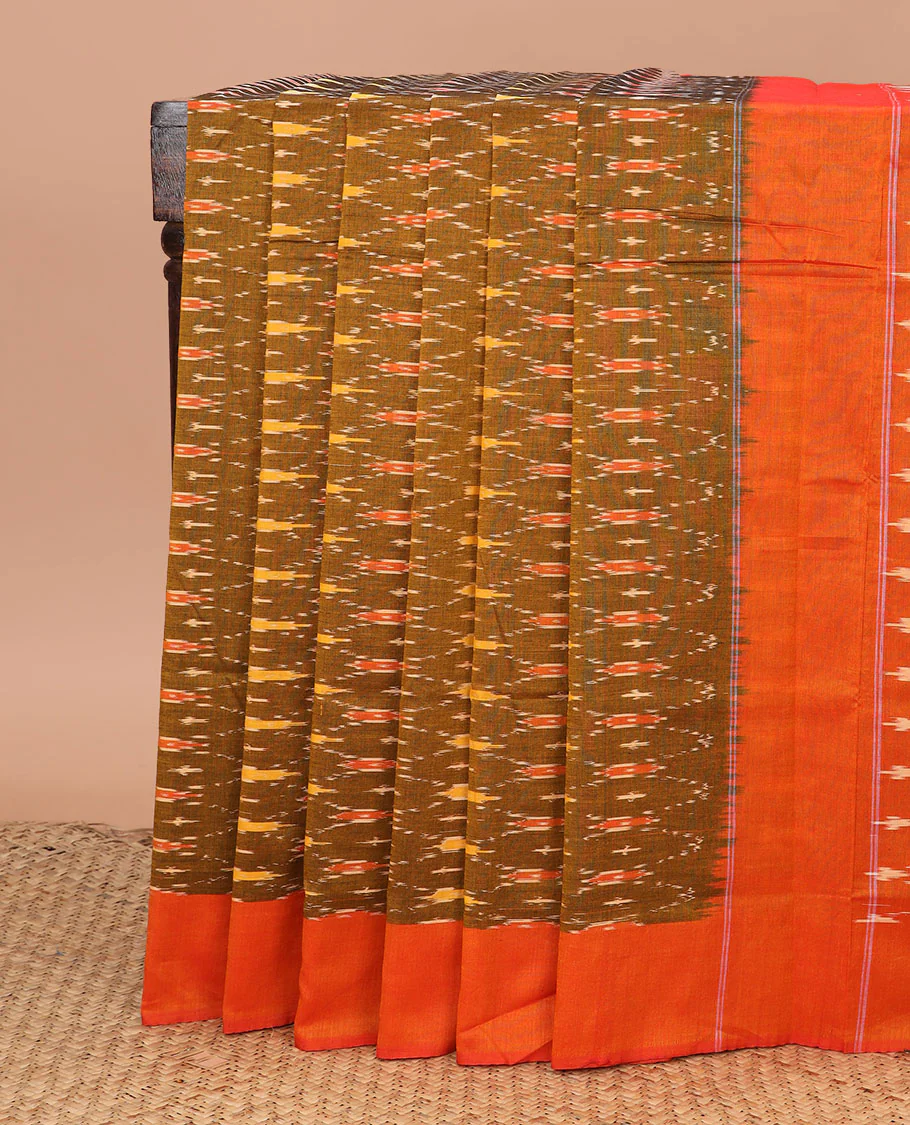 Green Ikkat Cotton Saree Featuring Ogee Patterns in Ikkat Weave, Complemented by a Contrast Plain Border, and Pallu Decked Up with Jaal Designs