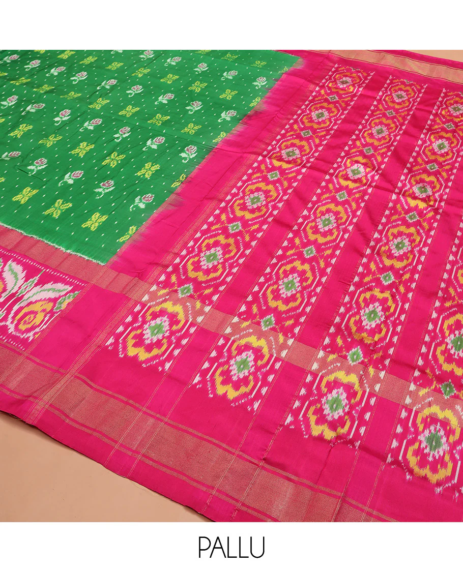Green Ikkat silk saree features floral Ikkat buttas, highlighted with a contrast Ikkat woven border, a hazily woven Ikkat patterned pallu, and a contrast blouse - Image 5
