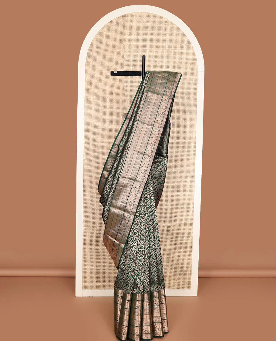 Green jacquard Kanchipuram wedding silk saree, zari border of rekku, muthu, laddu kamalam, mayil, mayil kann, and yaanai, intricate motifs zari woven pallu