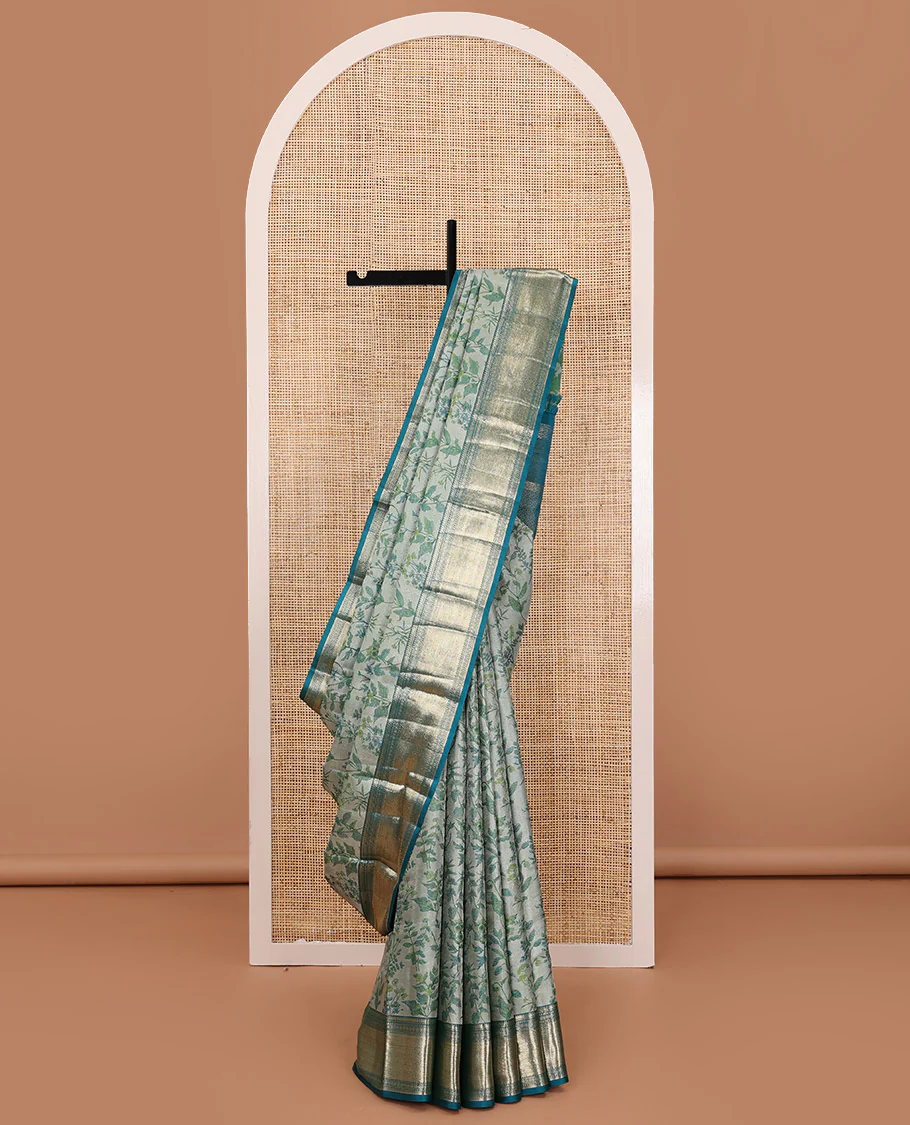 Green leaf printed Parampara silk saree, contrast border of thilakam mokku, muthu, diamond, and vanki designs, and jaal pallu