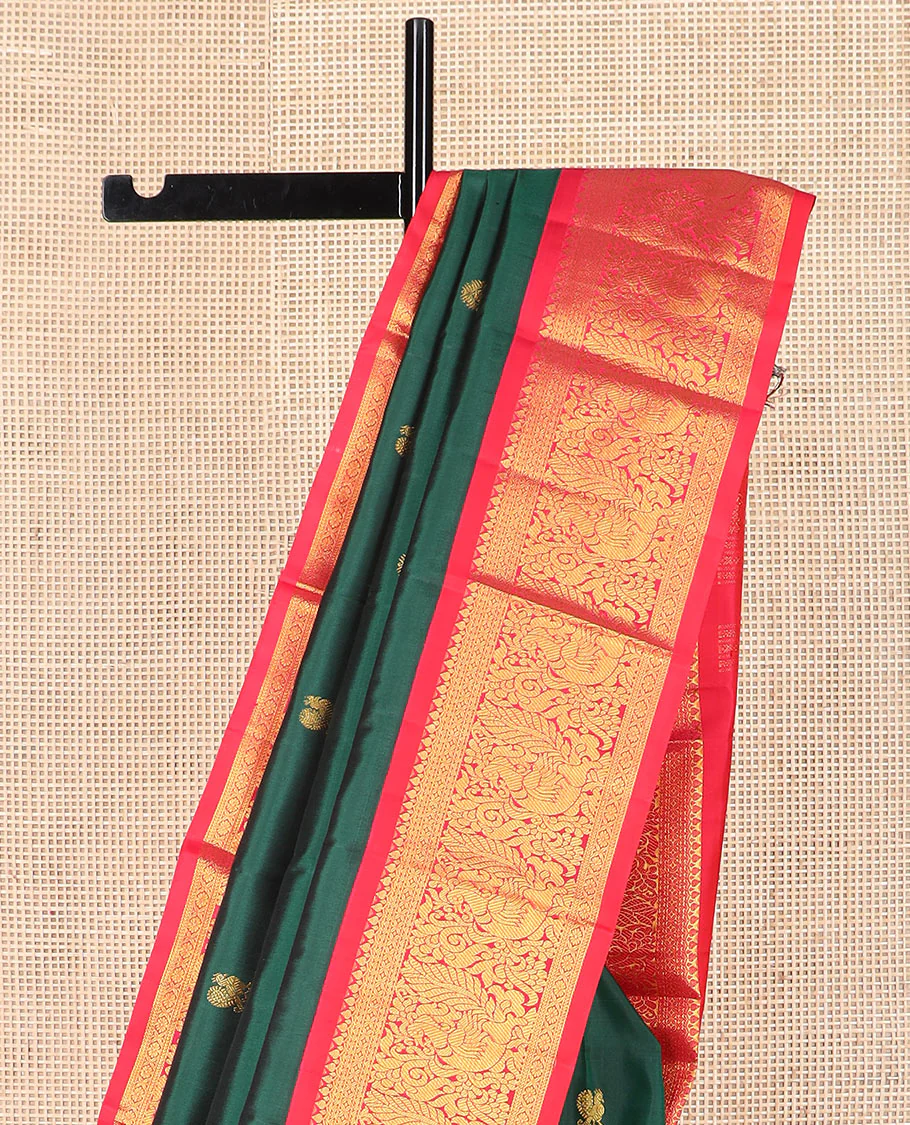 Green mayil chakram buttas Kanchipuram silk saree, contrast border of thilakam mokku, cross kamalam, and mayil designs, and zari design pallu - Image 3