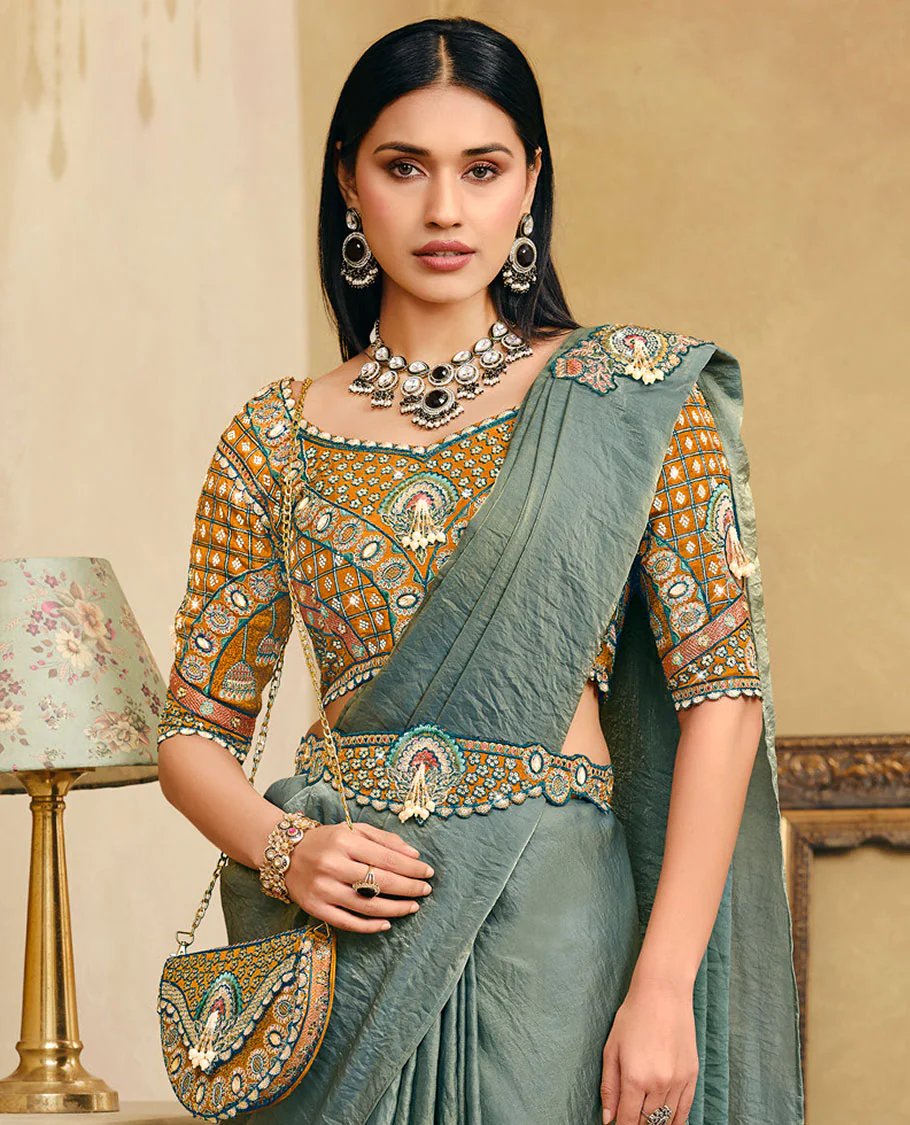 Green Plain Party Wear Designer Saree, Complemented with a Contrast Sweetheart Neck Heavy Embroidered Elbow Sleeve Readymade Blouse, Detachable Embroidered Belt, and a Free Embroidered Flap Sling Bag - Image 2