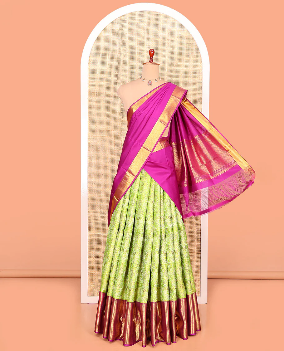 Green Pure Silk Half-Saree Artfully Detailed with Jacquard Design on Its Skirt, Complemented by a Contrast Border Featuring Rekku, Muthu, Kathir, and Mayil Kann Designs, Comes with a Contrast Jacquard Blouse and a Dhavani of Geometric Zari Designs