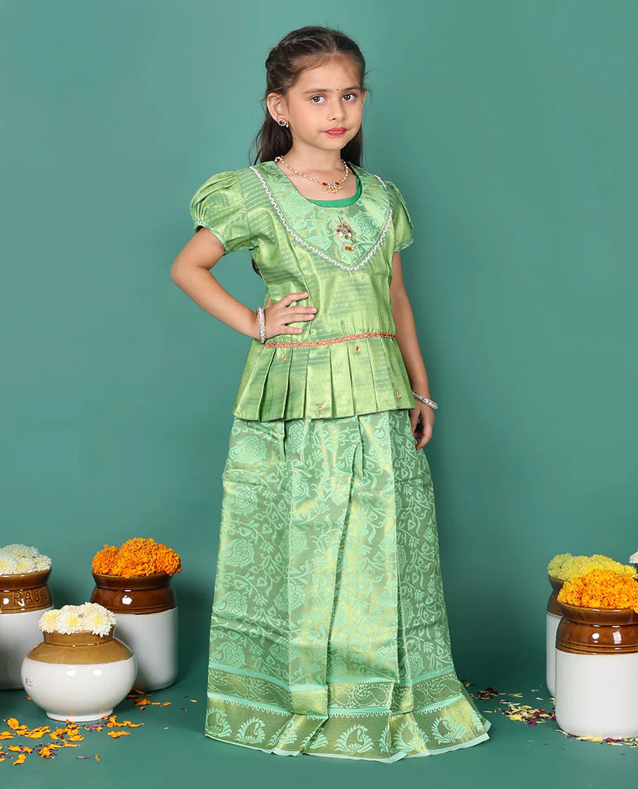 Green readymade art silk pavadai set, floral jaal jacquard with traditional zari border skirt, jacquard embroidered puff-sleeve blouse