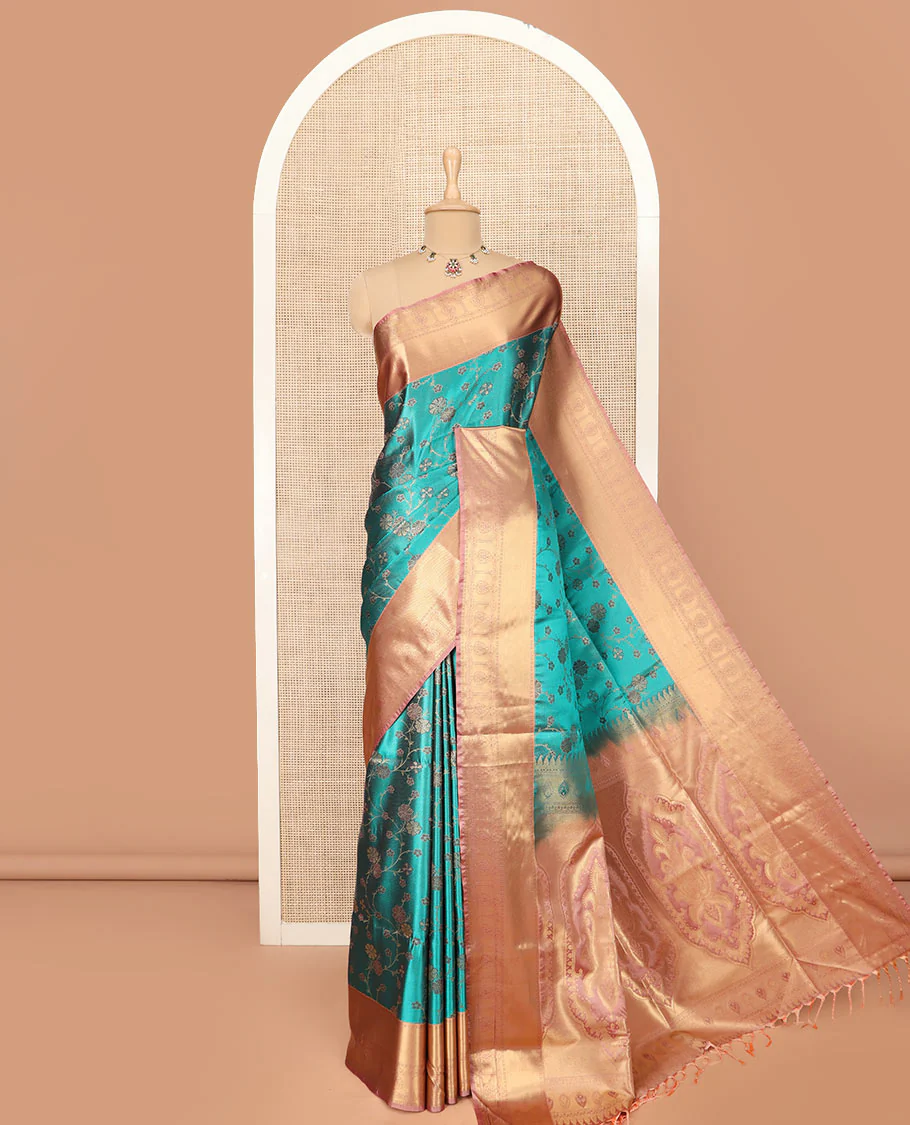 Green Semi-Soft Silk Saree Beautified with Floral Jaal Design All Over Its Body, Complemented by a Contrast Traditional Zari Design Border, Pallu of Intricate Designs, and Paired with a Contrast Blouse