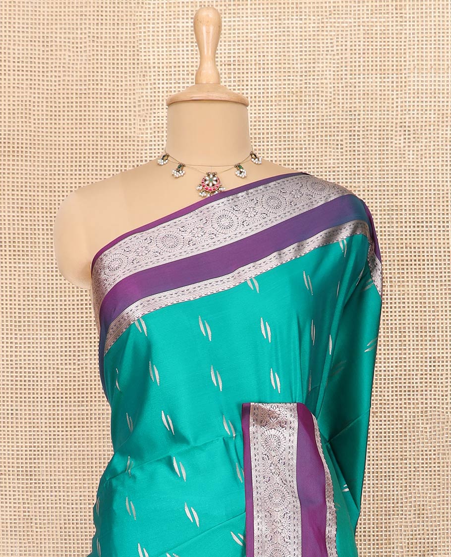 Green Semi-Soft Silk Saree Detailed with Zari Buttas All Over Its Body, Complemented by Contrast Traditional Zari Design Rettai Pettu Border, Pallu Enriched with Jaal Design, and Paired with a Contrast Blouse - Image 2