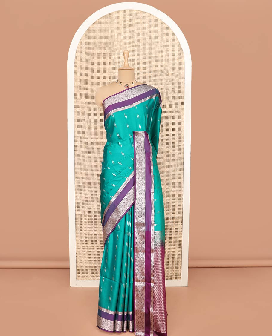 Green Semi-Soft Silk Saree Detailed with Zari Buttas All Over Its Body, Complemented by Contrast Traditional Zari Design Rettai Pettu Border, Pallu Enriched with Jaal Design, and Paired with a Contrast Blouse - Image 3