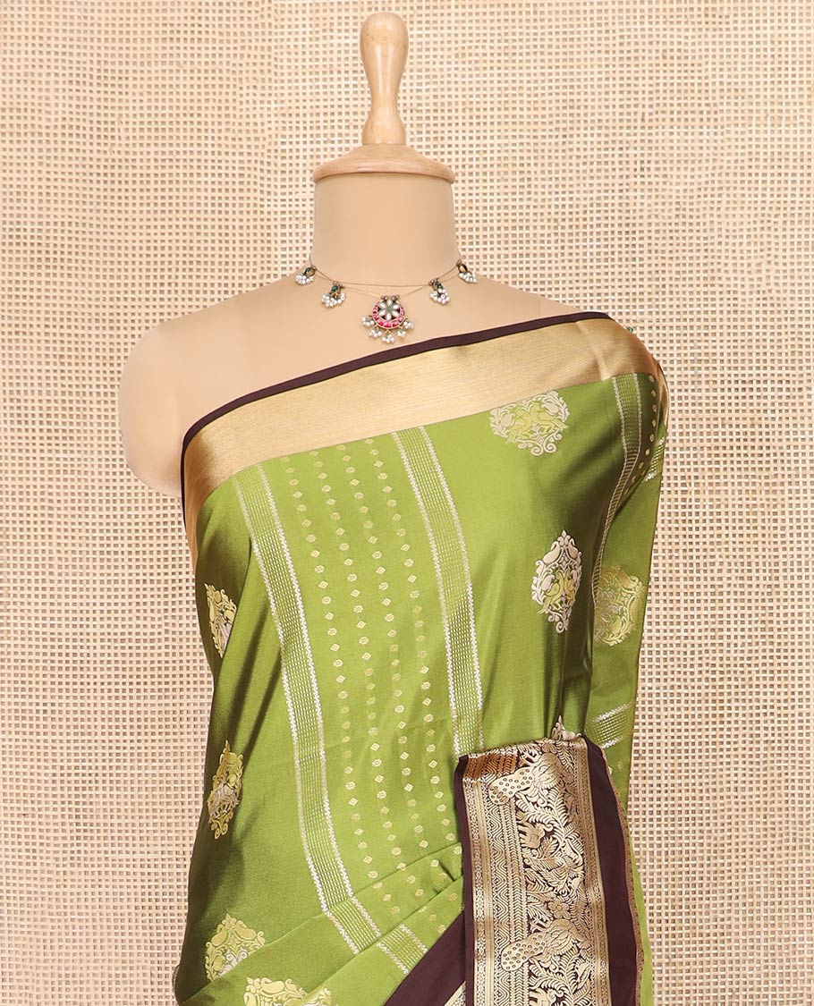 Green Semi-Soft Silk Saree Elevated with Intricate Designs Woven All Over Its Body, Complemented by Contrast Traditional Zari Design Rettai Pettu Border, Opulently Embellished Pallu of Intricate Zari Designs, and Paired with a Contrast Blouse - Image 2