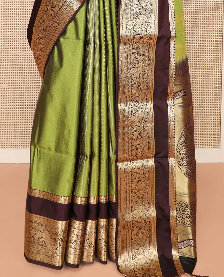 Green Semi-Soft Silk Saree Elevated with Intricate Designs Woven All Over Its Body, Complemented by Contrast Traditional Zari Design Rettai Pettu Border, Opulently Embellished Pallu of Intricate Zari Designs, and Paired with a Contrast Blouse - Image 4