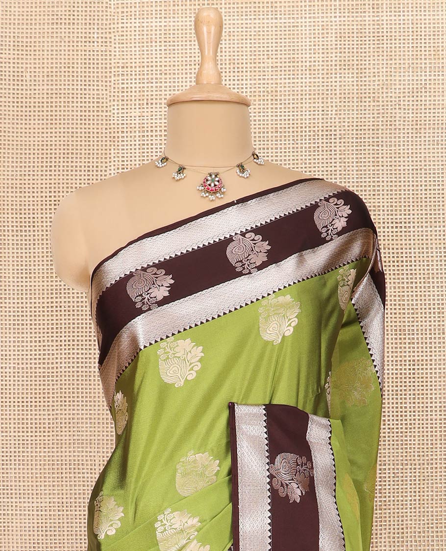 Green Semi-Soft Silk Saree Enriched with Floral Zari Buttas, Complemented by Contrast Traditional Zari Border Featuring Floral and Peacock Feather Motifs, Pallu Intricately Designed with Jaal Designs, and Paired with a Contrast Blouse - Image 2