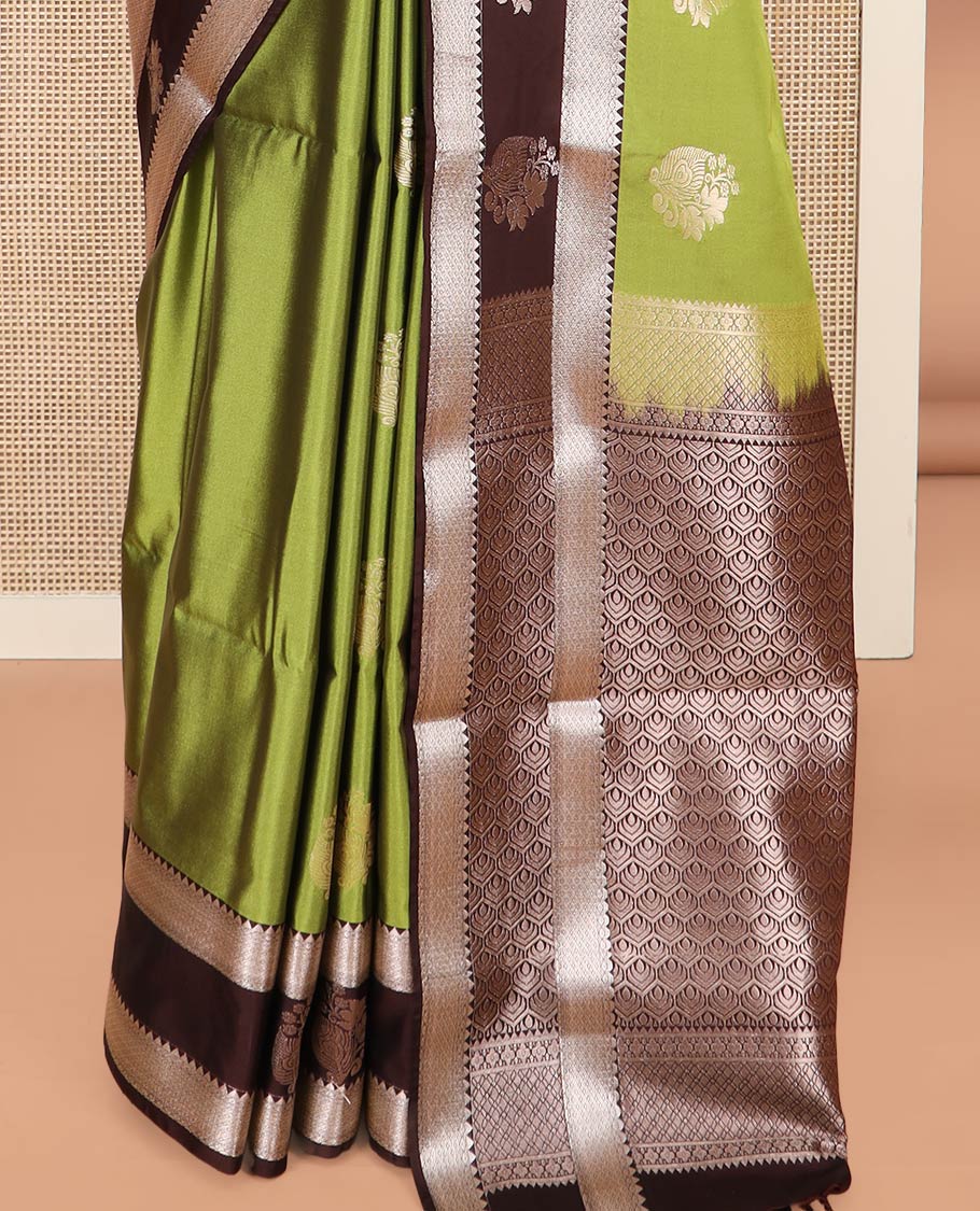 Green Semi-Soft Silk Saree Enriched with Floral Zari Buttas, Complemented by Contrast Traditional Zari Border Featuring Floral and Peacock Feather Motifs, Pallu Intricately Designed with Jaal Designs, and Paired with a Contrast Blouse - Image 4