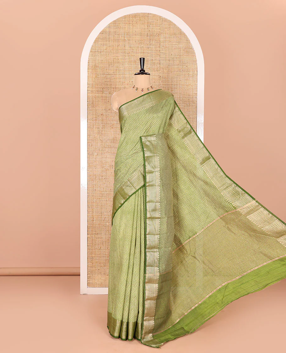 Green Semi-Tussar Saree Accentuated with Zig-Zag Strips Prints, Featuring a Self-border with Traditional Motifs, a Zari-Striped Pallu, Paired with a Matching Blouse