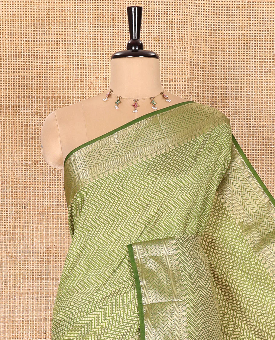 Green Semi-Tussar Saree Accentuated with Zig-Zag Strips Prints, Featuring a Self-border with Traditional Motifs, a Zari-Striped Pallu, Paired with a Matching Blouse - Image 2