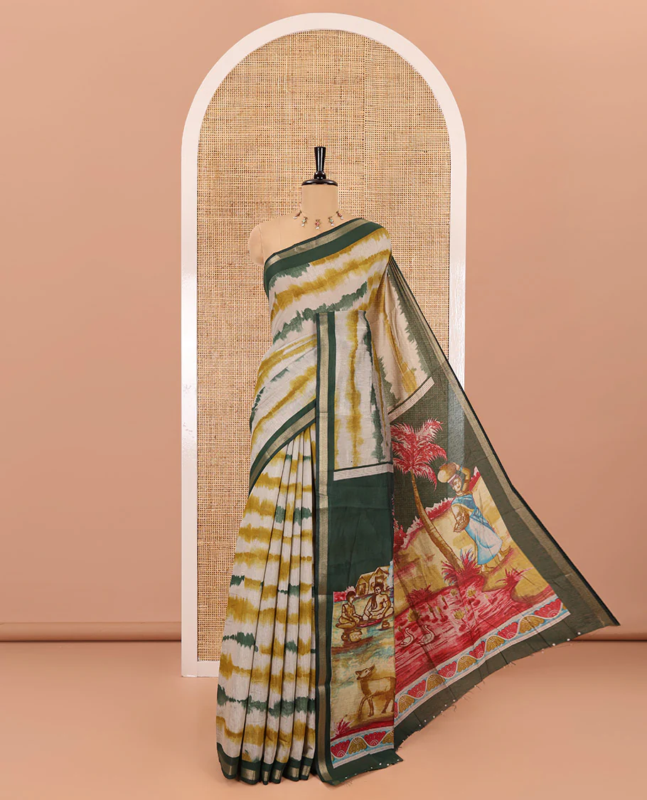 Green shibori printed muslin cotton saree, contrast zari border, village theme printed pallu, and a contrast dots printed blouse