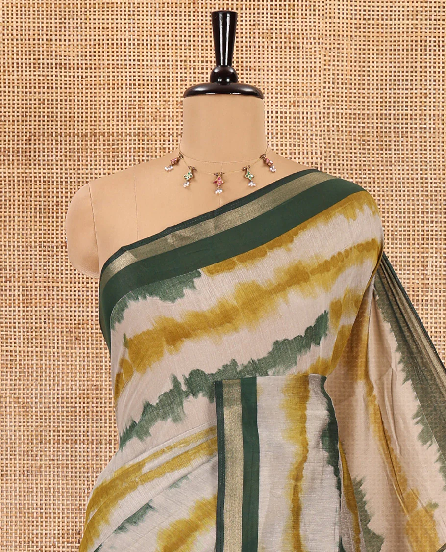 Green shibori printed muslin cotton saree, contrast zari border, village theme printed pallu, and a contrast dots printed blouse - Image 2