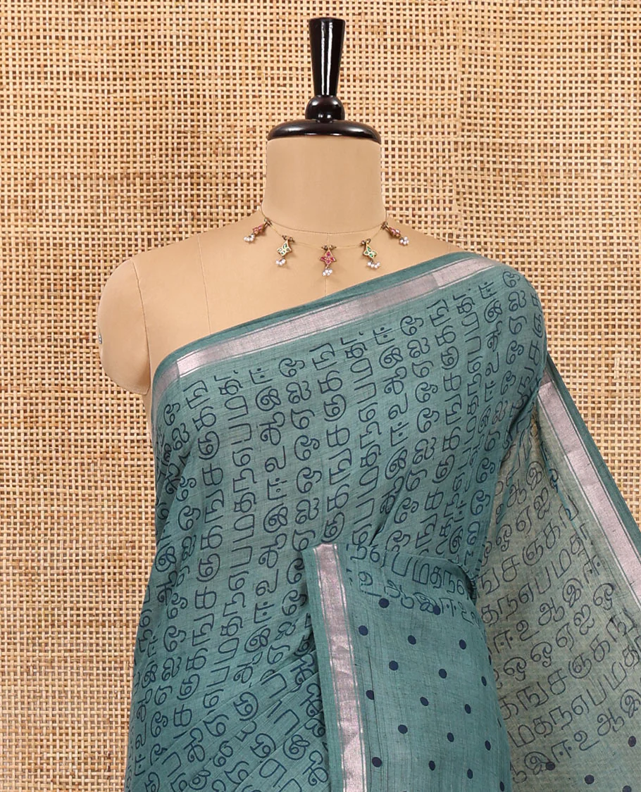 Green tamil letters printed soft cotton saree, zari piping border, small polka dotted pallu, and blouse of abstract and polka dots print - Image 2