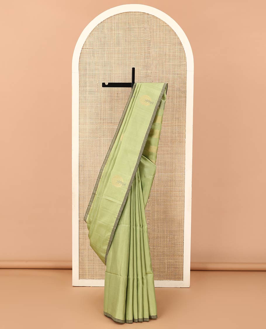 Green tree motifs zari woven Mayuri soft silk saree, striped piping border, and pallu of zari designs