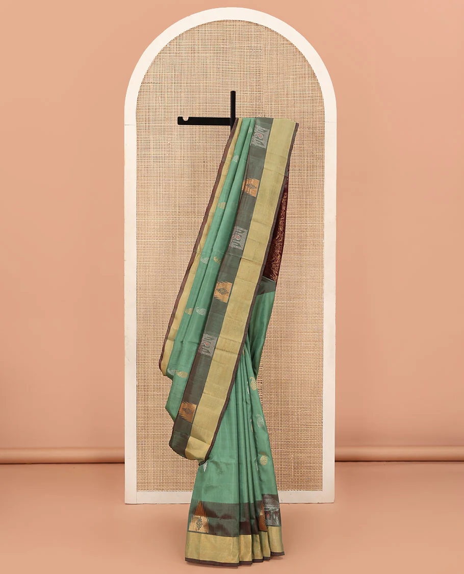 Green Uppada Silk Saree Accentuated with Paisley Buttas, Subtle Contrast Border of Temple Gopuram Motifs, Captivating Pallu Featuring Floral Jaal Design, and Paired with a Contrast Blouse