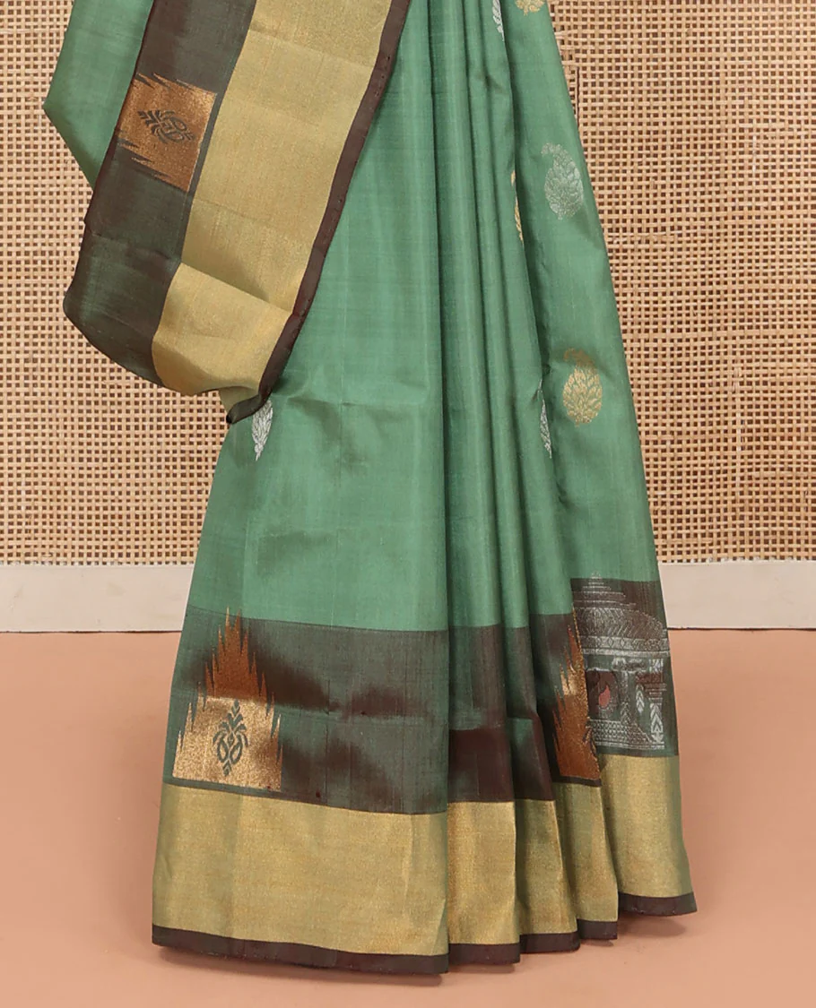 Green Uppada Silk Saree Accentuated with Paisley Buttas, Subtle Contrast Border of Temple Gopuram Motifs, Captivating Pallu Featuring Floral Jaal Design, and Paired with a Contrast Blouse - Image 4