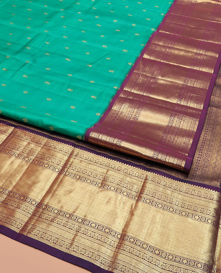 Green Vasundhara Silk Saree Subtly Sparked with Zari Buttas, Highlighted with a Contrast Big Zari-Decked Traditional Motifs Woven Border, Pallu Steeped with Traditional Zari Designs, and Paired with a Contrast Blouse - Image 2