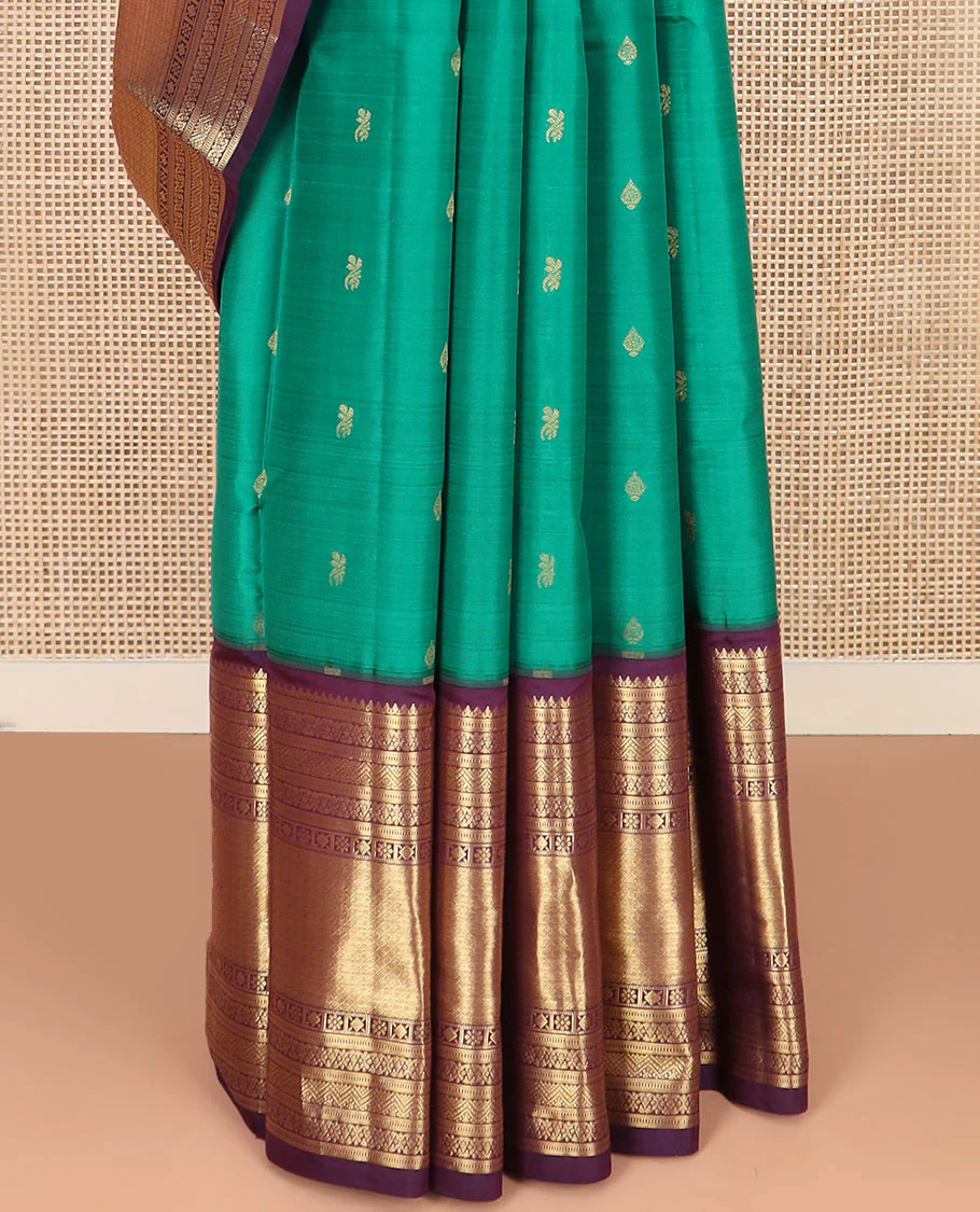 Green Vasundhara Silk Saree Subtly Sparked with Zari Buttas, Highlighted with a Contrast Big Zari-Decked Traditional Motifs Woven Border, Pallu Steeped with Traditional Zari Designs, and Paired with a Contrast Blouse - Image 4