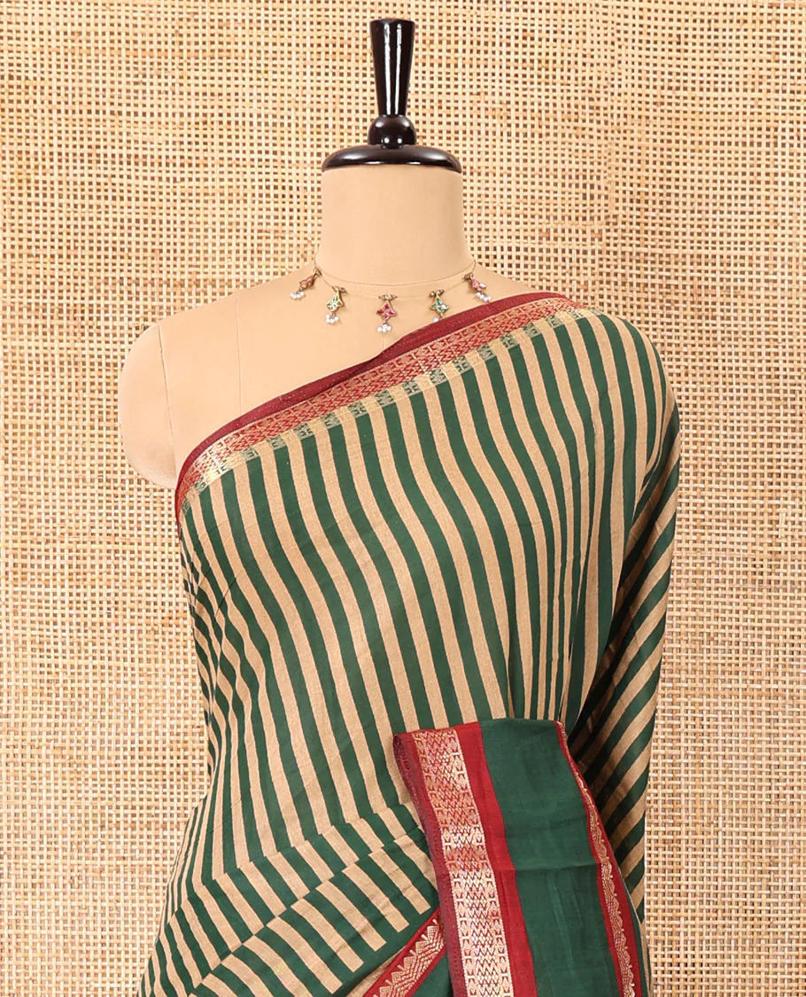 Green vertically striped muslin silk saree, contrast zari rettai pettu border, kalamkari floral vine printed pallu, and a contrast plain blouse - Image 3
