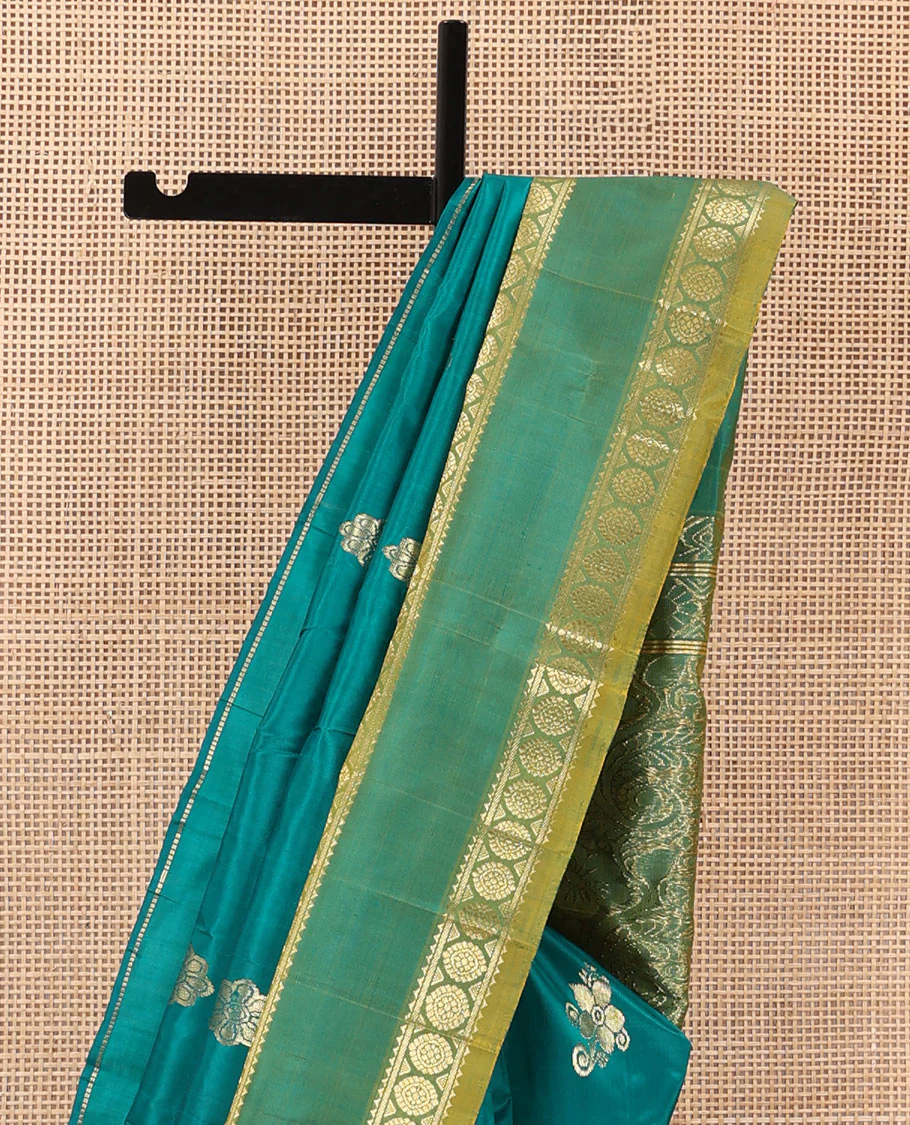 Green zari buttas Kanchipuram silk saree, contrast one-sided rettai pettu border of rekku, and laddu kamalam, and floral design pallu - Image 4