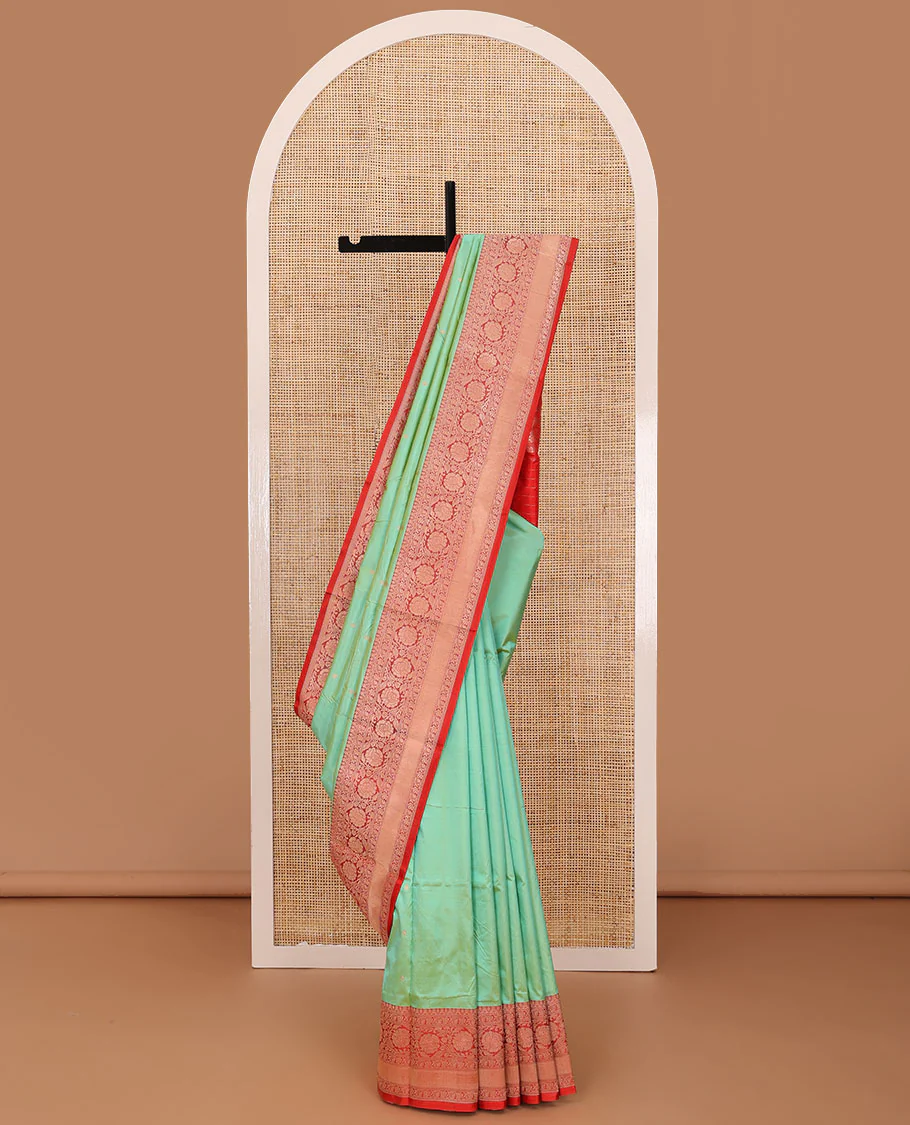 Green zari buttas katan silk saree, contrast traditional border of floral creeper design, and floral jaal pallu