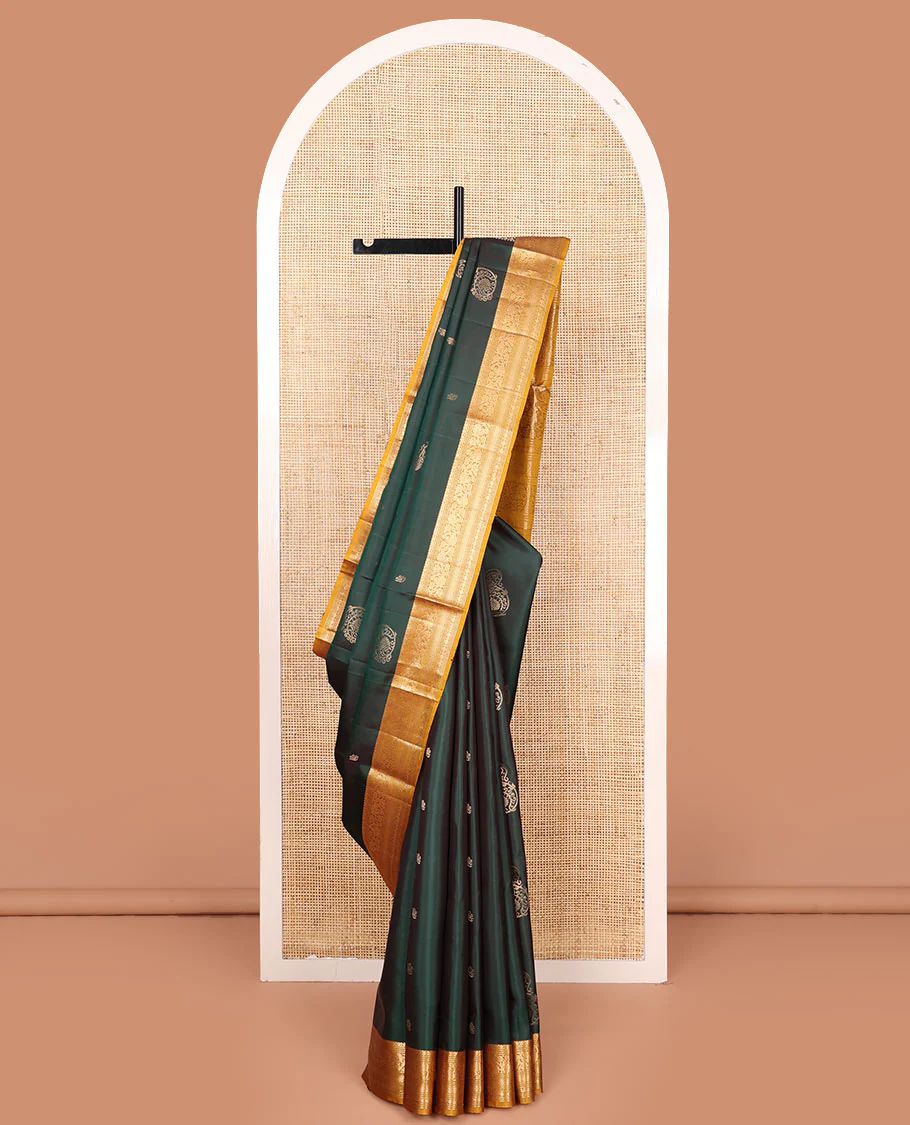 Green zari buttas Mayuri soft silk saree, contrast border of salngai, muthu, banaras, kodi visiry, rudraksham, and mayil kann, and floral vine pallu
