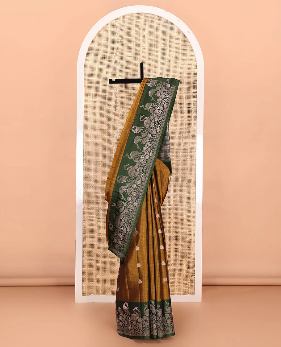 Green zari buttas Mayuri soft silk saree, contrast floral and bird motifs border, and pallu of jaal, floral, and bird designs