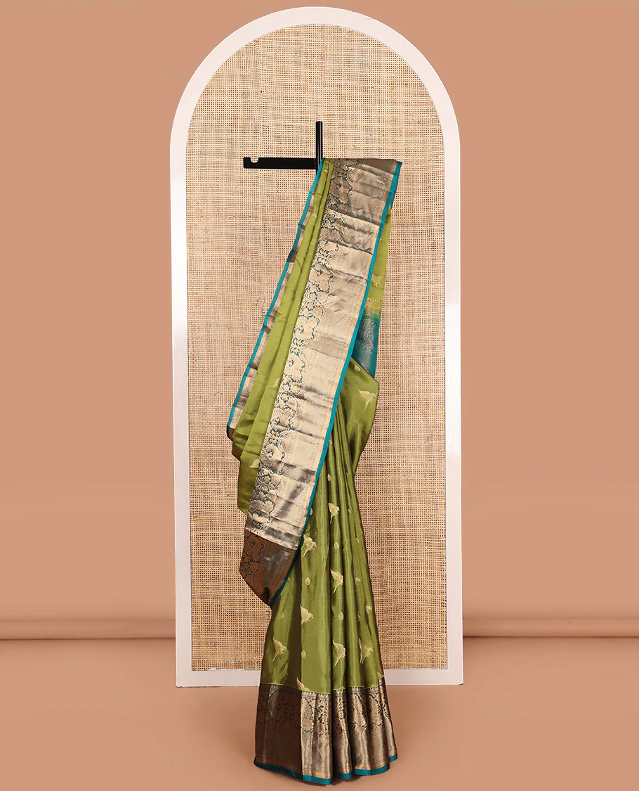 Green zari buttas Vasundhara Lite Silk Mix Saree, contrast border of thilakam mokku, muthu, mayil, laddu kamalam, and kuyil kann designs, and pallu of paisleys