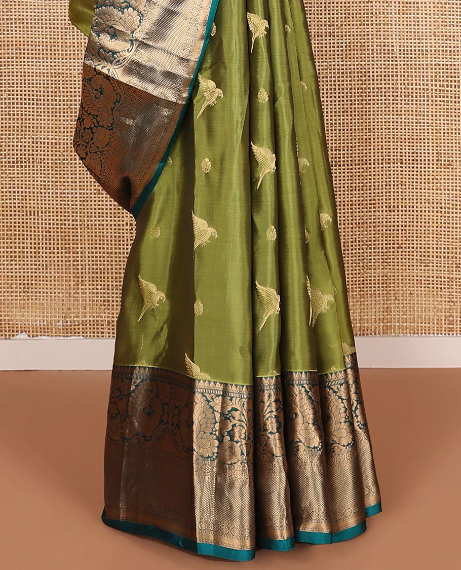Green zari buttas Vasundhara Lite Silk Mix Saree, contrast border of thilakam mokku, muthu, mayil, laddu kamalam, and kuyil kann designs, and pallu of paisleys - Image 4