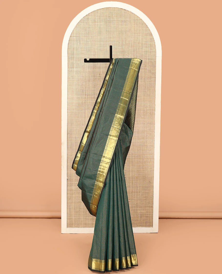 Green zari checked Kanchipuram silk saree, zari border of thilakam mokku, muthu, and manga designs, and jaal pallu