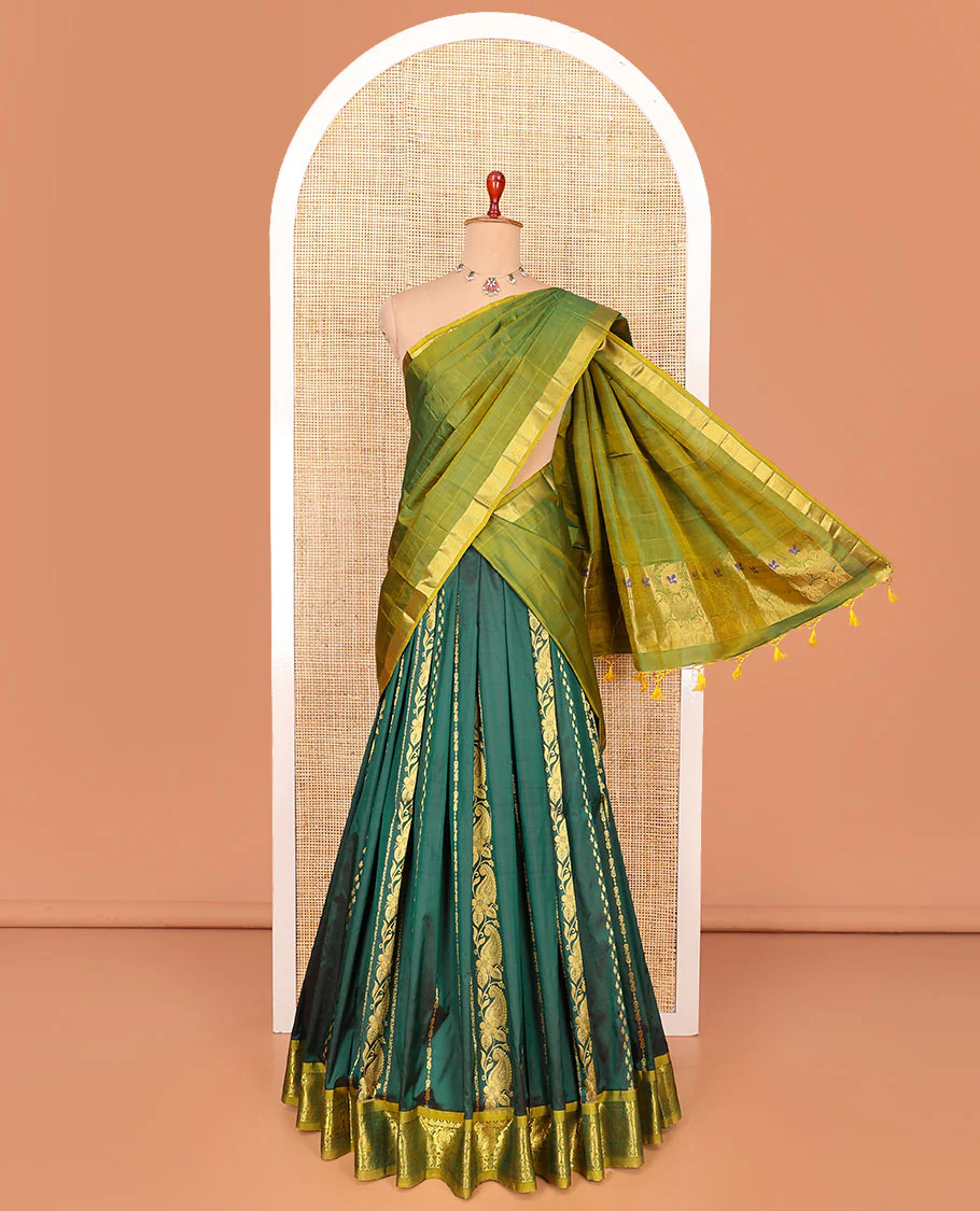 Green zari design pure-silk half-saree with contrast border of floral-paisley zari designs, contrast zari bordered blouse, and a dhavani of paisley-leaf designs