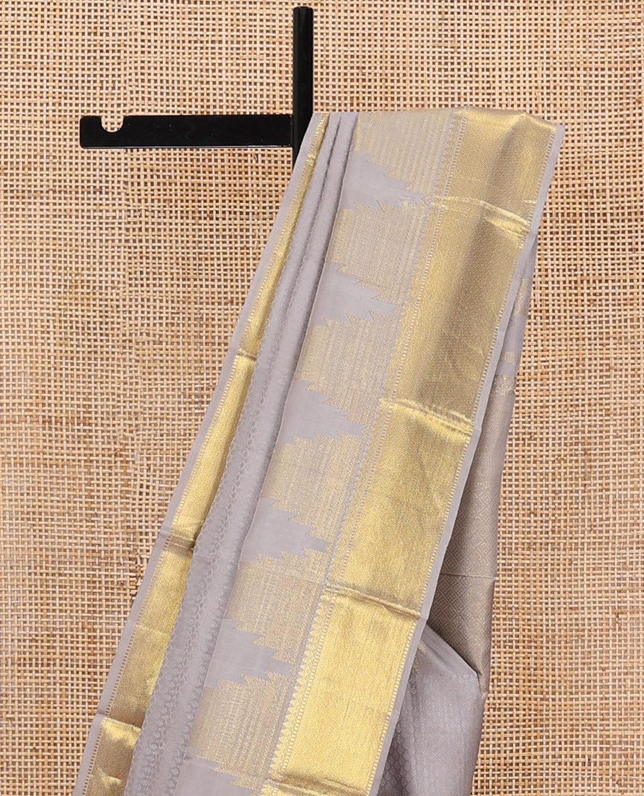 Grey embossed Parampara silk saree, thazampoo rekku golden zari border of thilakam mokku, muthu, and vanki designs, and zari rich jaal pallu - Image 4