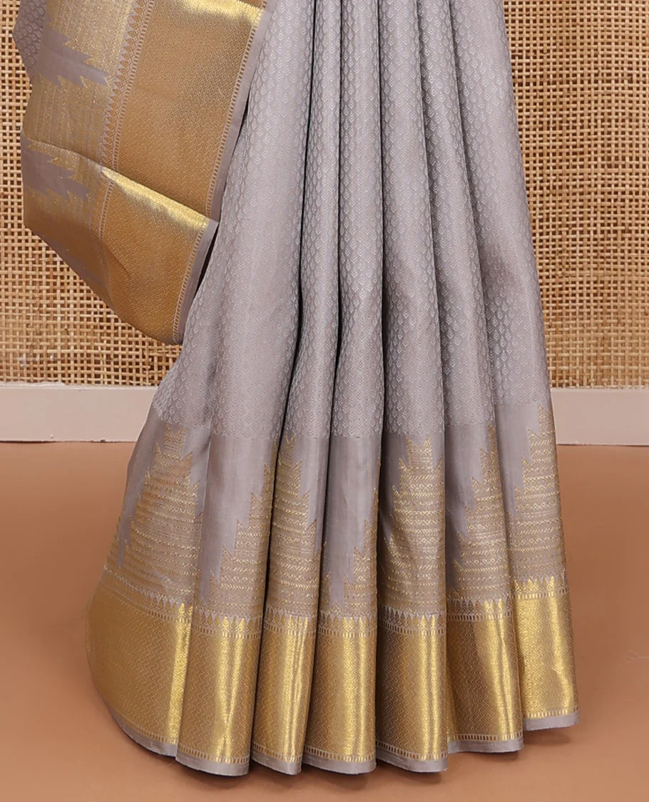 Grey embossed Parampara silk saree, thazampoo rekku golden zari border of thilakam mokku, muthu, and vanki designs, and zari rich jaal pallu - Image 5