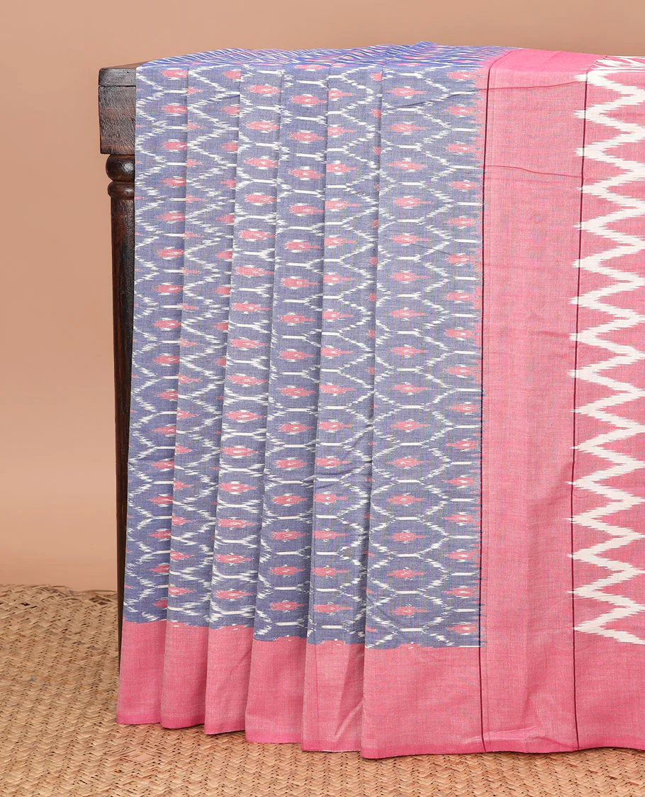 Grey Ikkat Cotton Saree Embellished with Ogee Patterns in Ikkat Weave, Complemented by a Contrast Plain Border, and Pallu Bedecked with Chevron Stripes